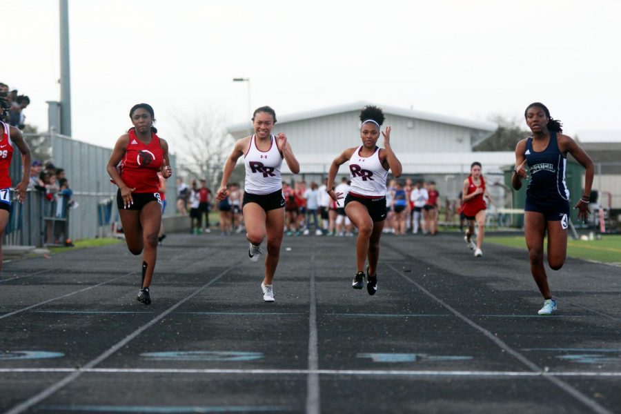 Jade Jordan and Tianna Goodlow racing to the finish in the 100 meter dash.